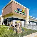Starz R Us Early Learning Center exterior with a fenced playground