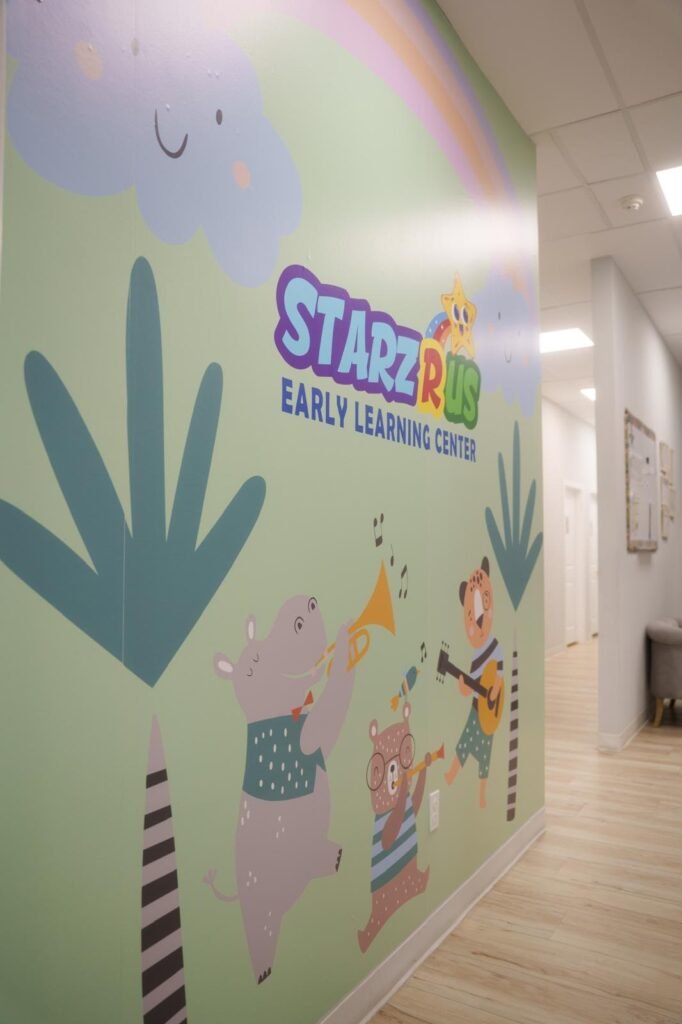 Colorful Starz R Us mural inside the learning center